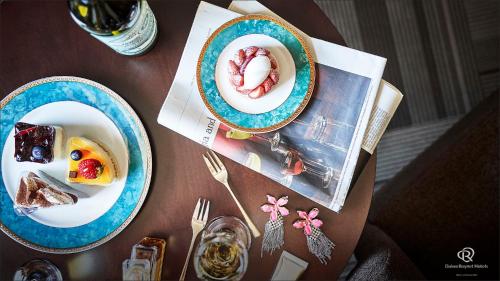 a table with two plates of food on it at Daiwa Roynet Hotel Hachinohe in Hachinohe