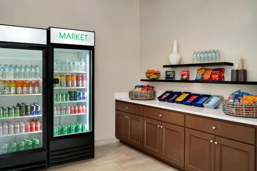 a drink cooler in a store with drinks in it at Wingate by Wyndham Williamsburg in Williamsburg