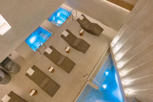 an overhead view of a group of chairs in a room at Grand Fiesta Americana Los Cabos All Inclusive Golf & Spa in Cabo San Lucas