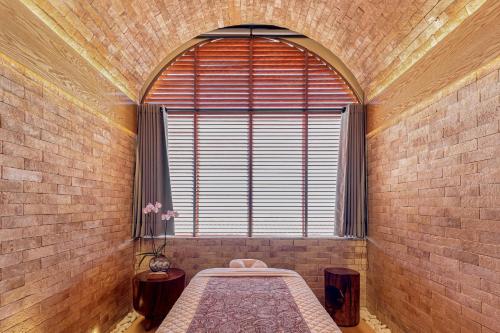 a room with a large window with a bed in it at Grand Fiesta Americana Los Cabos All Inclusive Golf & Spa in Cabo San Lucas