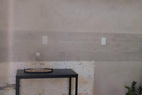 a room with a table and a wall with light switches at Nice and well located apartment in Santa Fe in Caucel