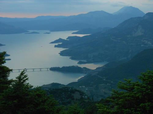 a view of a large body of water with a bridge at Oihalia Guesthouse in Fidhákia