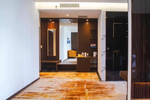 a room with a hallway with a room with a hallway at SANDALS AQUILA HOTEL in Bao Loc