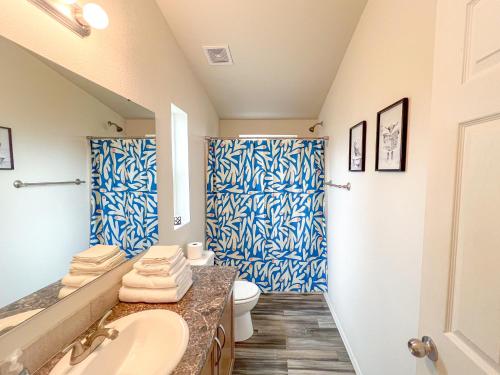 a bathroom with a sink and a toilet at Ridgeview Oasis in Poway