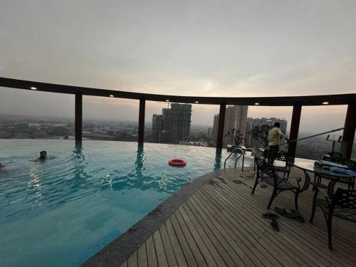 a swimming pool on the top of a building at 3-BHK with pool & highway view. in Ghaziabad