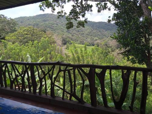 a view of the mountains from the balcony of a house at RS Holiday Residence in Ilukkumbura