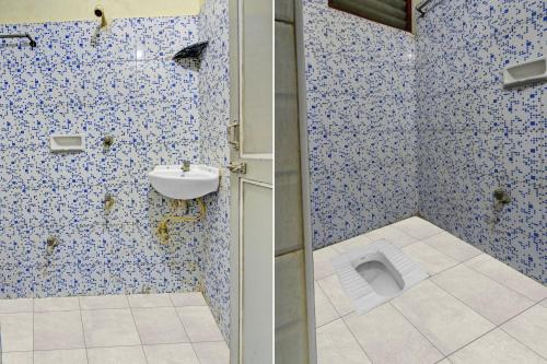 a bathroom with a sink and a toilet at Hotel O Dream Palace Guest House Near Marina Beach in Chennai