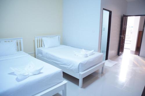 เตียงในห้องที่ โรงแรม ปารวี บูทีค เชียงราย (Parawee Boutique Hotel)