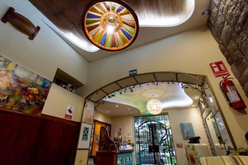 a store with a ceiling with a stained glass window at ArtPlaza in Quito