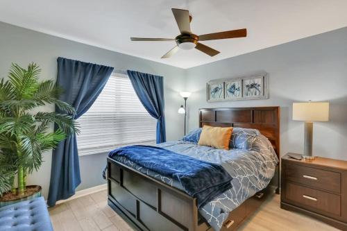 a bedroom with a bed and a ceiling fan at Seaside Oasis 52 in Fort Myers