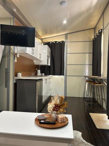 a kitchen with a table with a plate on it at Katherine Farmstay Caravan Park in Katherine