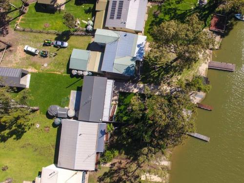 an overhead view of a group of houses next to a river at 103 at Walkers in Walker Flat