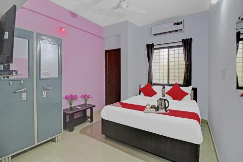 Ένα ή περισσότερα κρεβάτια σε δωμάτιο στο Hotel O Happy Stay