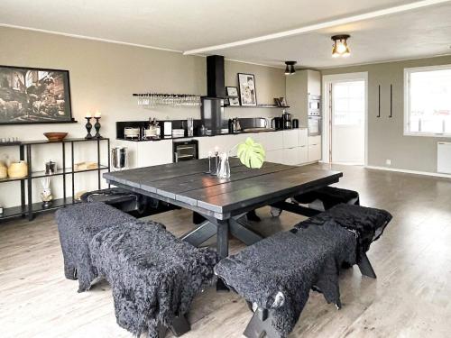 a dining room with a wooden table and chairs at 4 star holiday home in KÖPINGSVIK-By Traum in Köpingsvik