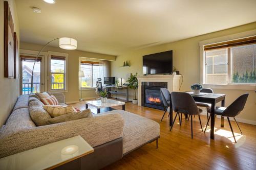 a living room with a couch and a table at Stylish North Seattle Townhouse- Dual Master Suites in Seattle