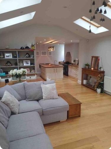 a living room with a couch and a table at Spacious 3-Bed Home in York Free Parking Sleeps 5 in York