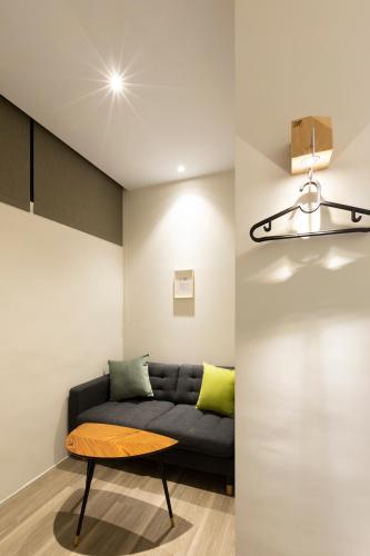 a living room with a couch and a table at Meander 1948 in Taipei