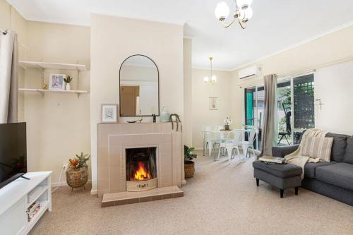 a living room with a fireplace and a couch at The Peach Tree 2 Bed Home in Elizabeth