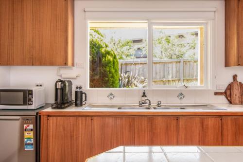 a kitchen with a sink and a window at Arden Monte Vista in Rye