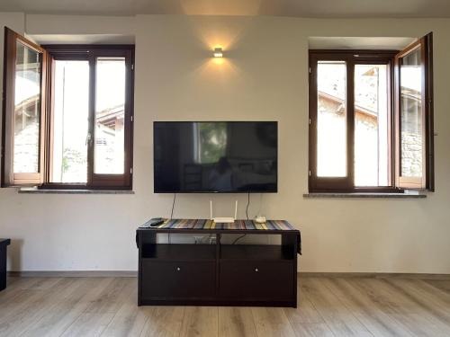 a living room with a flat screen tv on the wall at Home in Orvieto - Via dei Dolci in Orvieto