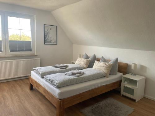 a bedroom with a bed with two towels on it at Ferienhaus Rupnow Plau am See in Plau am See