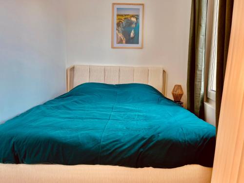 Łóżko lub łóżka w pokoju w obiekcie L’échappée Mer