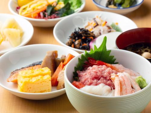 a group of bowls filled with different types of food at Iwaki Washington Hotel in Iwaki