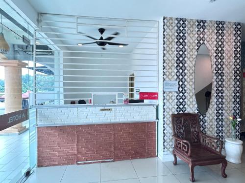 a bar in a restaurant with a ceiling fan at BEAR HOTEL at NILAI in Nilai