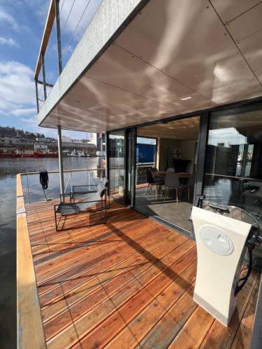 a deck on a yacht with a view of the water at Prague Stream in Prague