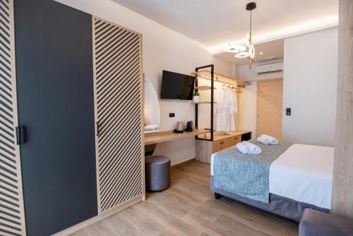 Ένα ή περισσότερα κρεβάτια σε δωμάτιο στο John & Mary Suites