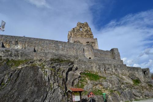 a castle on the side of a mountain at Suita beli Labod in Medvode