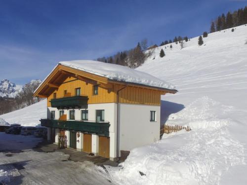 a small building with snow on top of a snow covered slope at Modern Holiday Home in Maria Alm near Ski Area in Maria Alm am Steinernen Meer
