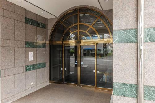 an entrance to a building with revolving doors at Bios Sapporo in Sapporo