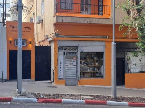 a store on the side of a city street at Fellini Fortunella terrace (talpiot) in Haifa