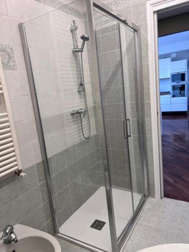 a shower with a glass door in a bathroom at Residence Tufilla in Ascoli Piceno