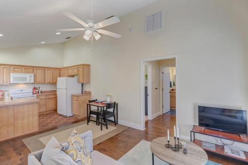 a kitchen and a living room with a ceiling fan at Large 1 BR carriage house in historic SPR in Jacksonville