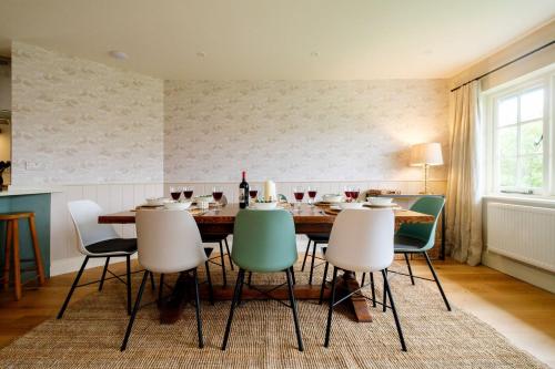 a dining room with a table and chairs at 9 The Haven in Thorpeness