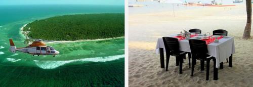 PARADISE HUT KAVARATTI في كوتشي: طاولة وكراسي ومروحة على الشاطئ