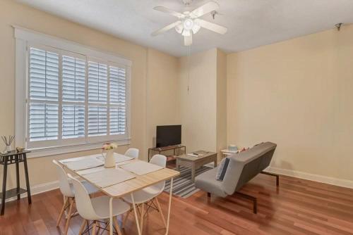 a living room with a table and chairs and a television at LT Stay Discounts! Cozy 2 BR Apt - Pet Friendly! in Jacksonville