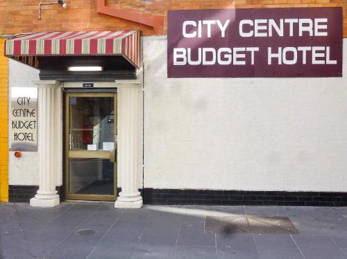 a city centre budget hotel with a sign over the door at City Centre Budget Hotel in Melbourne