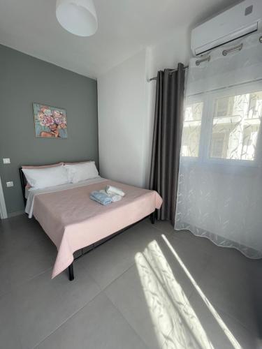 Postel nebo postele na pokoji v ubytování IRIS Apartment