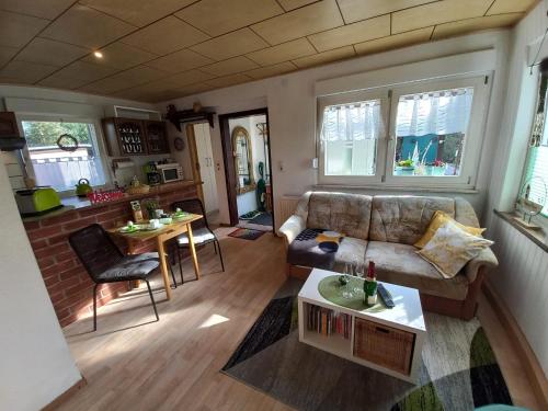 a living room with a couch and a table at Ferienhaus Hilde in Sangerhausen