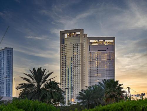 a tall building with the word hotel on it at Onyx Arjaan by Rotana in Manama