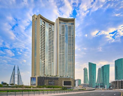 a city skyline with tall buildings and a road at Onyx Arjaan by Rotana in Manama