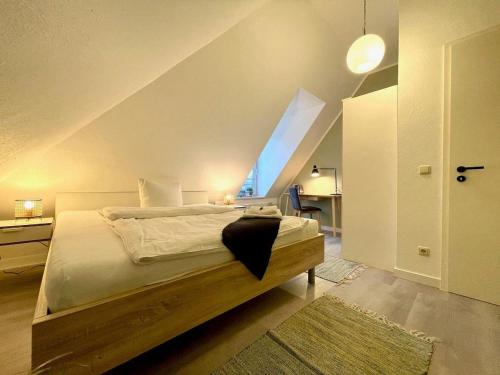 a bedroom with a bed with an attic at Apartment-Zschachwitz-kleine-Wohlfuehlferienwohnung in Dresden