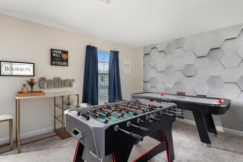 a play room with a foosball table in a room at 1509 MC - Exquisite 8BR Villa with Pool Games in Davenport