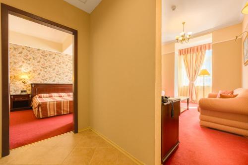 Un ou plusieurs lits dans un hébergement de l'établissement Boutique Splendid Hotel