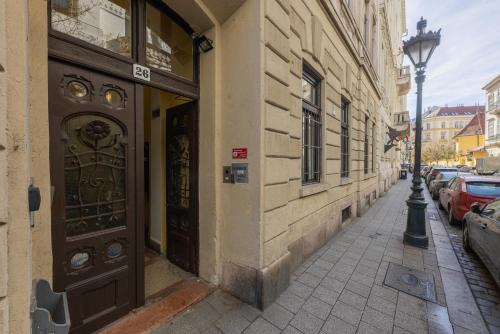 a building with a door on the side of a street at Amber Gardenview Studios Downtown in Budapest