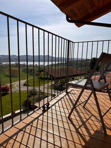 a balcony with a chair and a view at Cascina Coste in Roppolo
