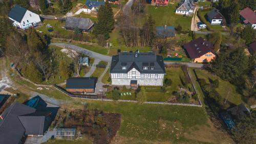 an aerial view of a large house in a neighborhood at Theresian Apartment in Ostružná